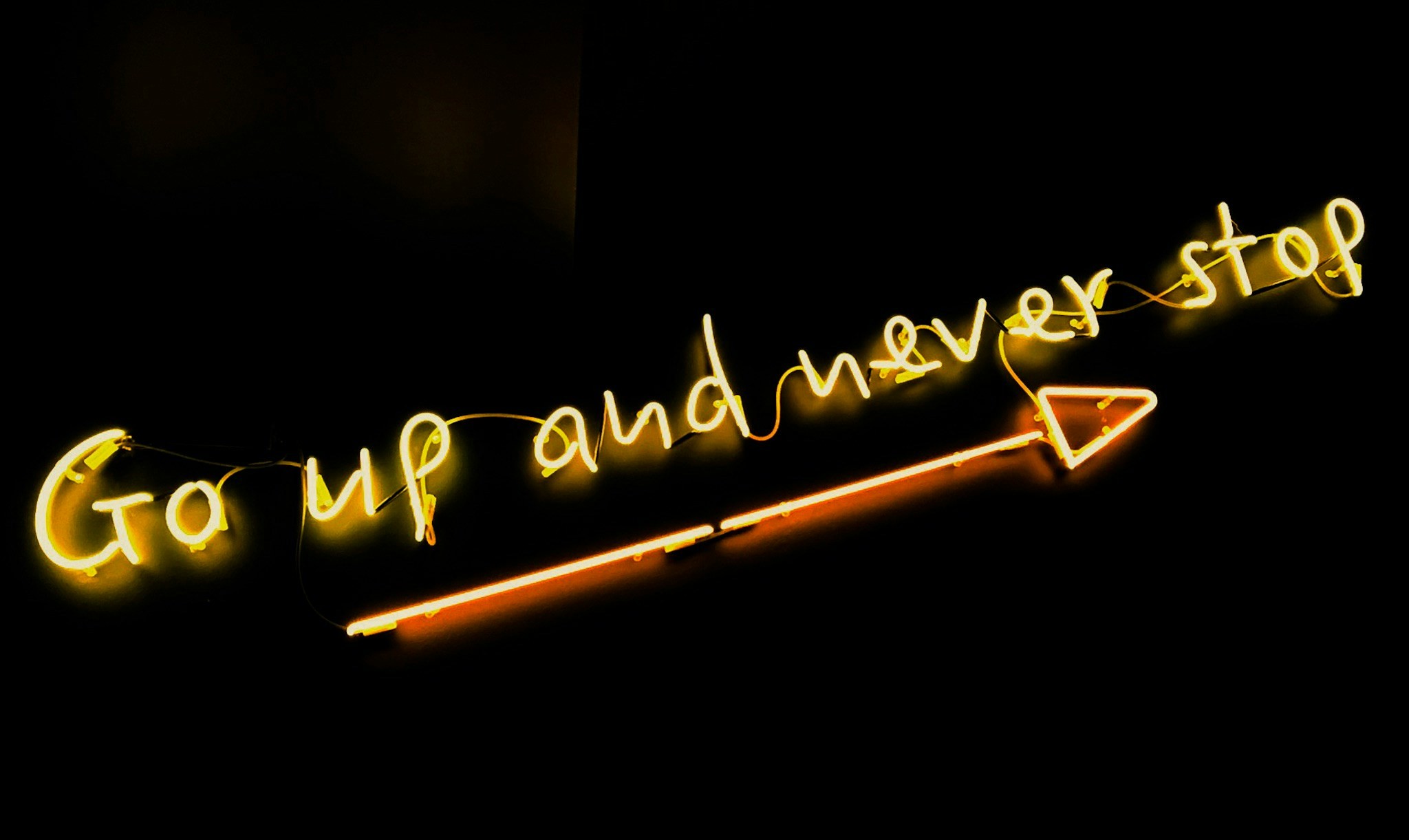 Go up and never stop neon sign